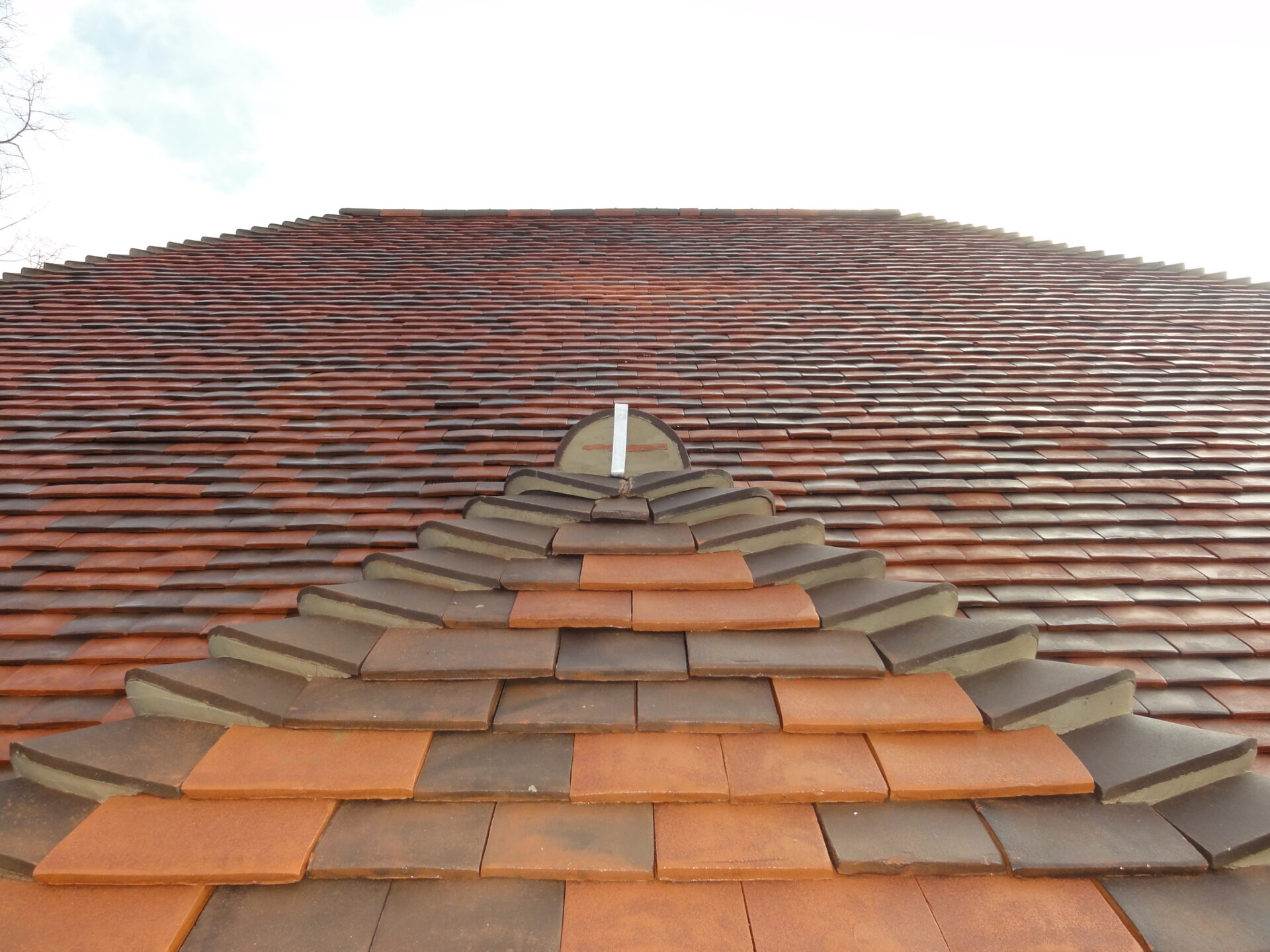 Newly bedded in pitched roofing tiles.