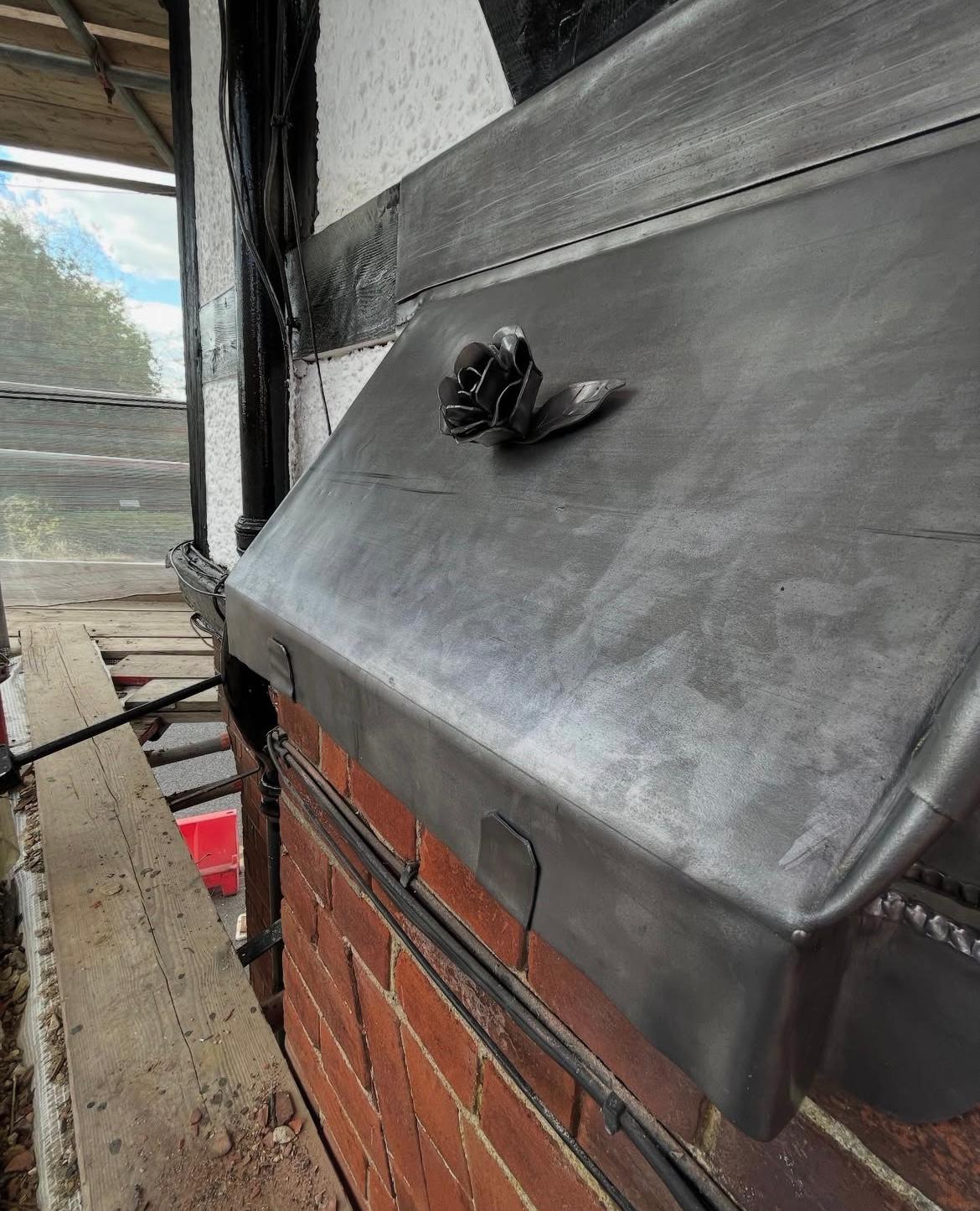 View of repair works under way on pitched roof.