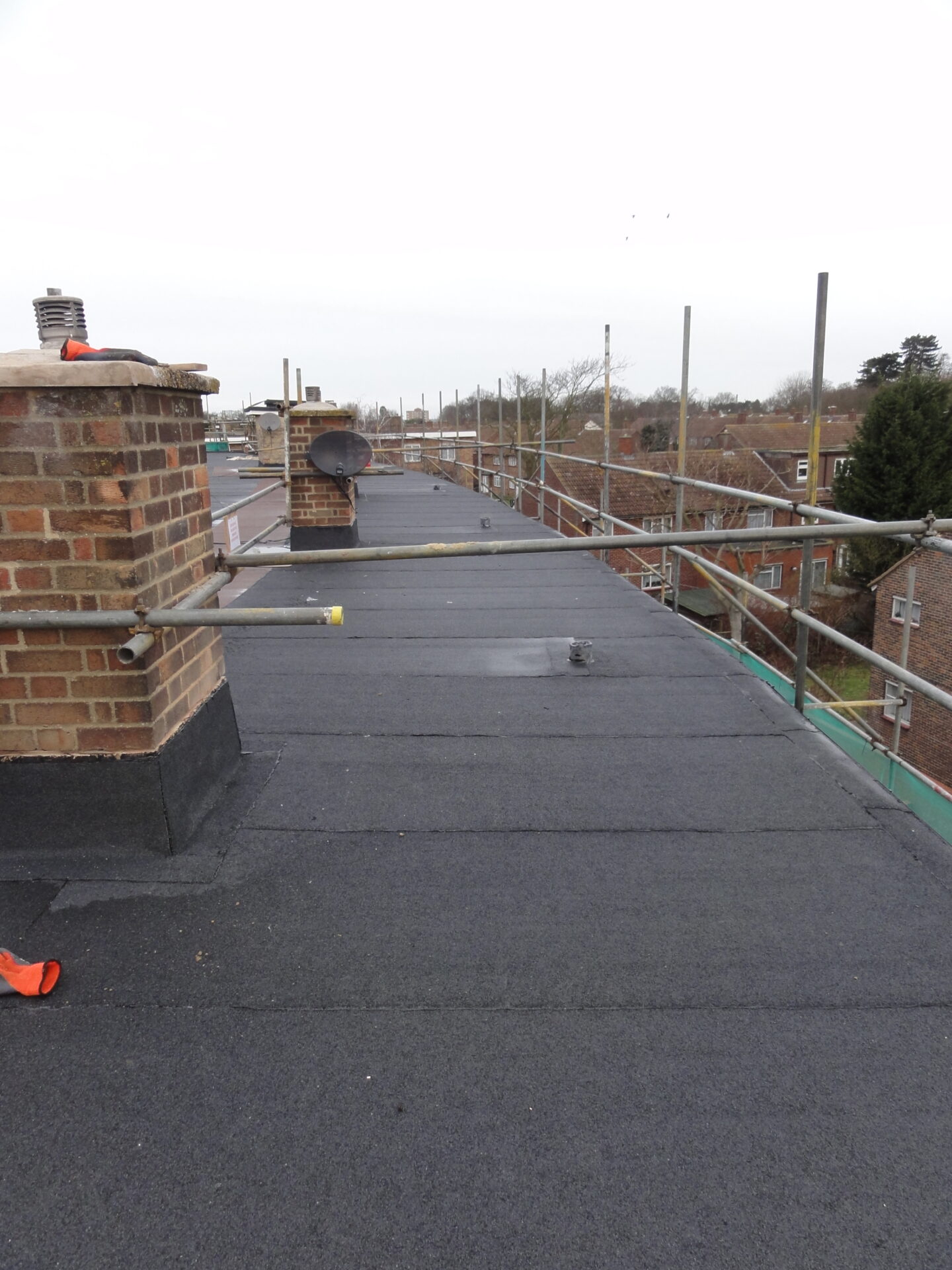 Flat roof with scaffolding whilst work undertaken.